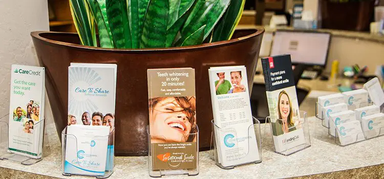 Scheduling Service Country Club dentist flagstaff - multiple flyers on a stone desk