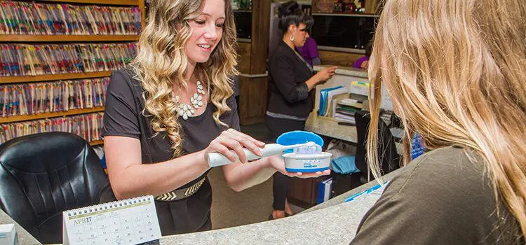 Insurance Information Country Club dentist flagstaff - person demonstrating dental care on mock teeth