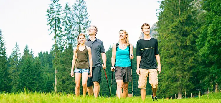 country club dental dentures coconino flagstaff - four people on grass in a forest