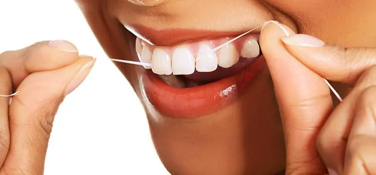 country club dental non surgical flagstaff - close up of person flossing teeth