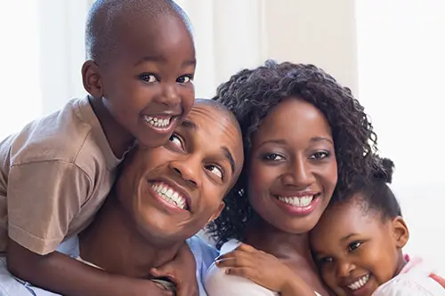 country club dentist coconino flagstaff arizona - smiling faces of a family of four