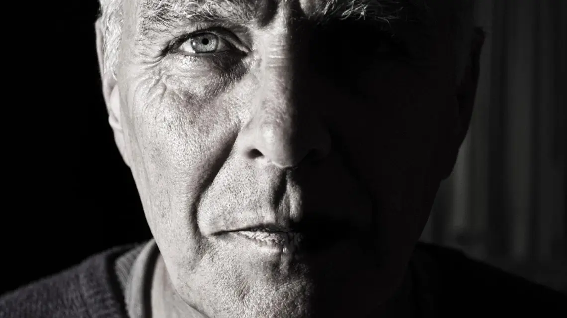 early detection of oral cancer - black and white image of an older man's face