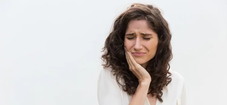 Emergency Dental Care in Flagstaff - woman holding mouth in dental pain