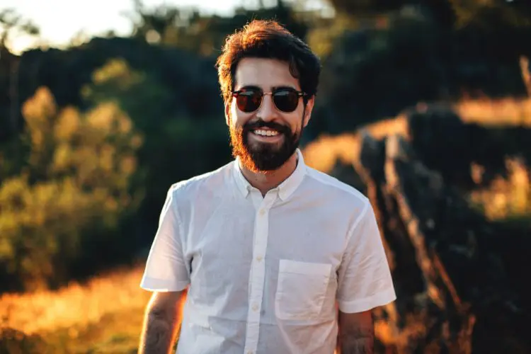 man smiling wearing sunglasses