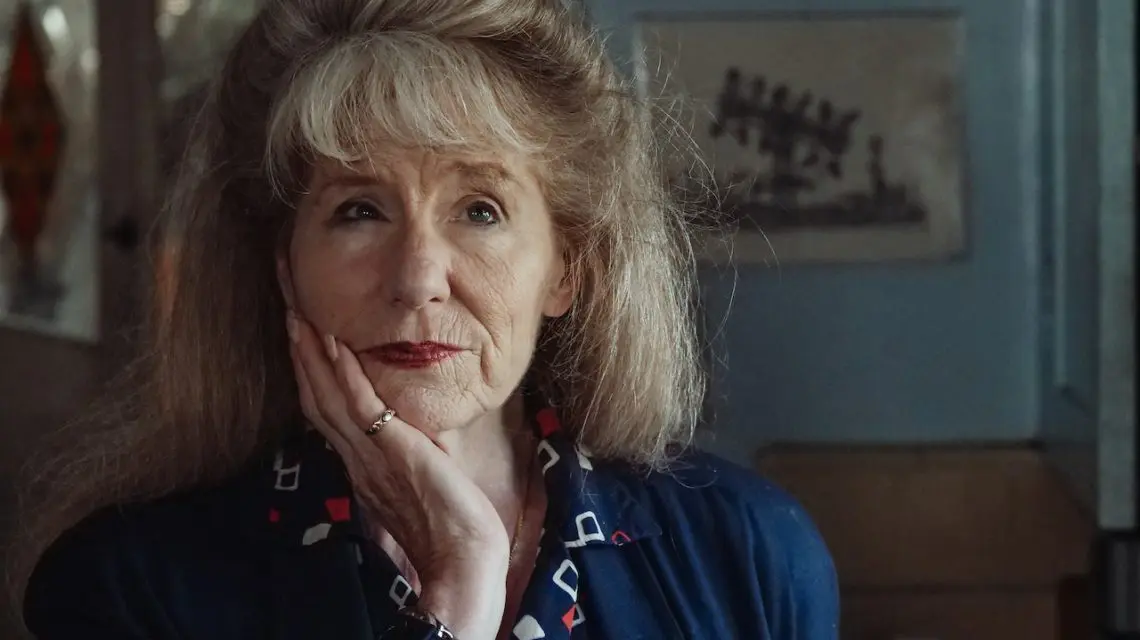 older woman looking concerned with hand on chin