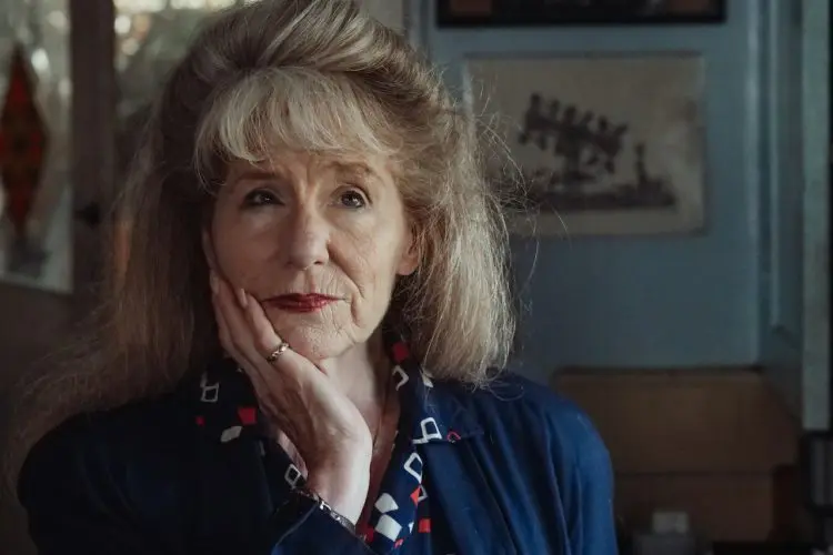 older woman looking concerned with hand on chin