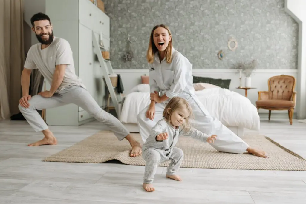 family doing yoga with toddler