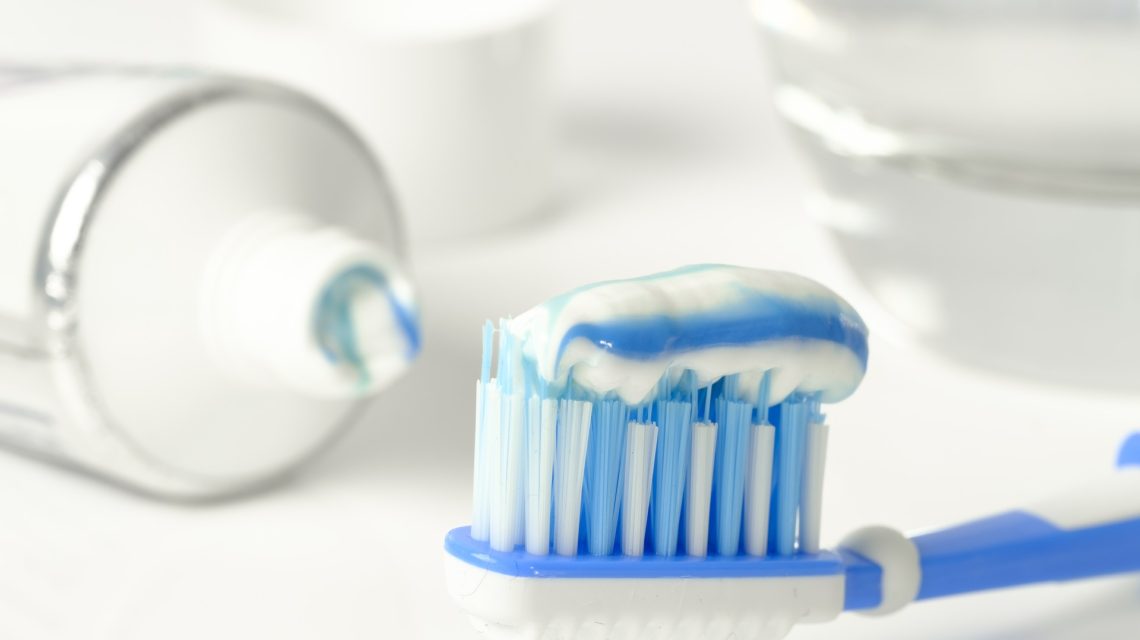 Dental Tips for the Holidays - close up of toothpaste on toothbrush