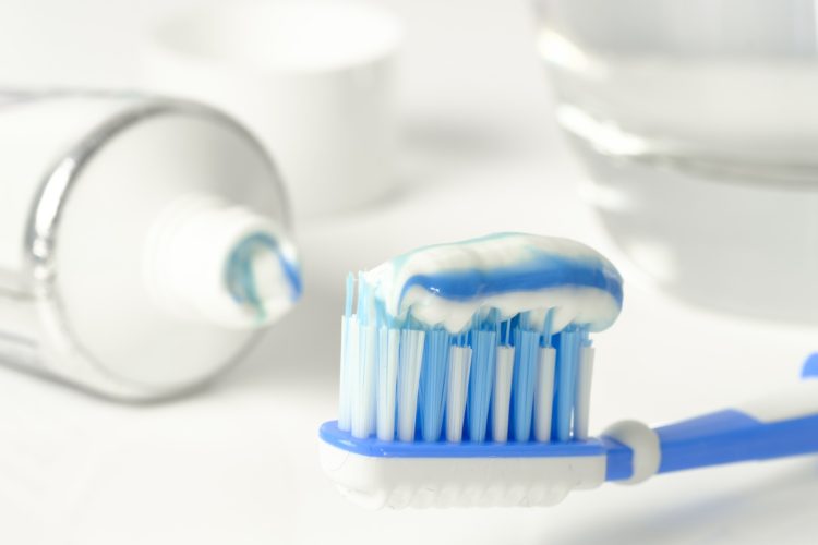 Dental Tips for the Holidays - close up of toothpaste on toothbrush