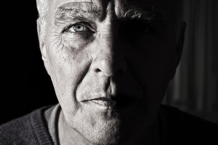 early detection of oral cancer - black and white image of an older man's face