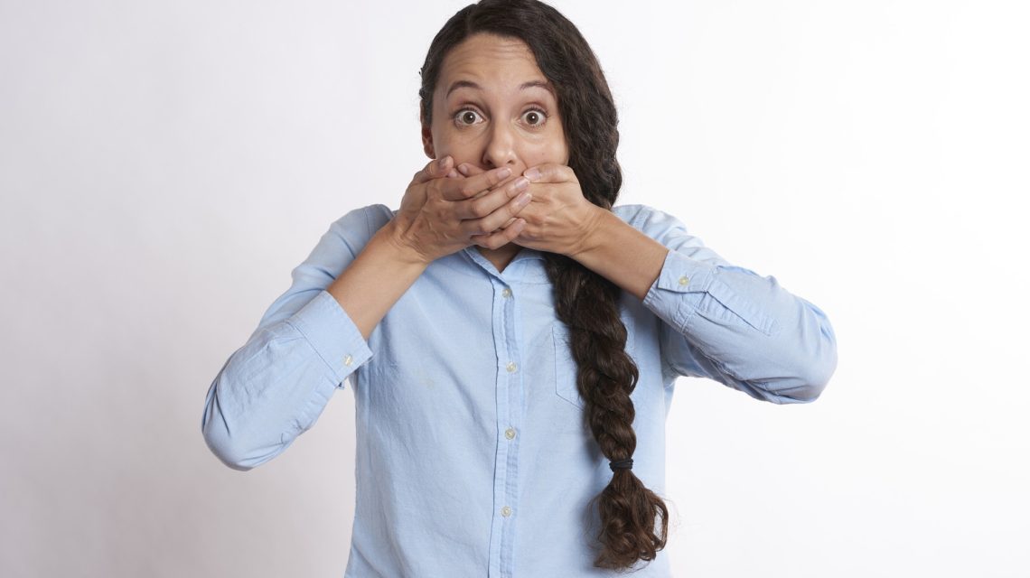 how to kill bacteria in mouth - causes of bad breath woman covering her mouth with hands