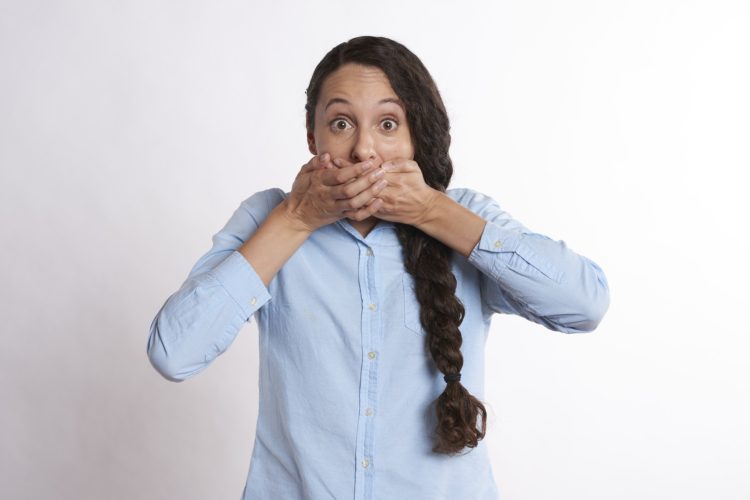how to kill bacteria in mouth - causes of bad breath woman covering her mouth with hands