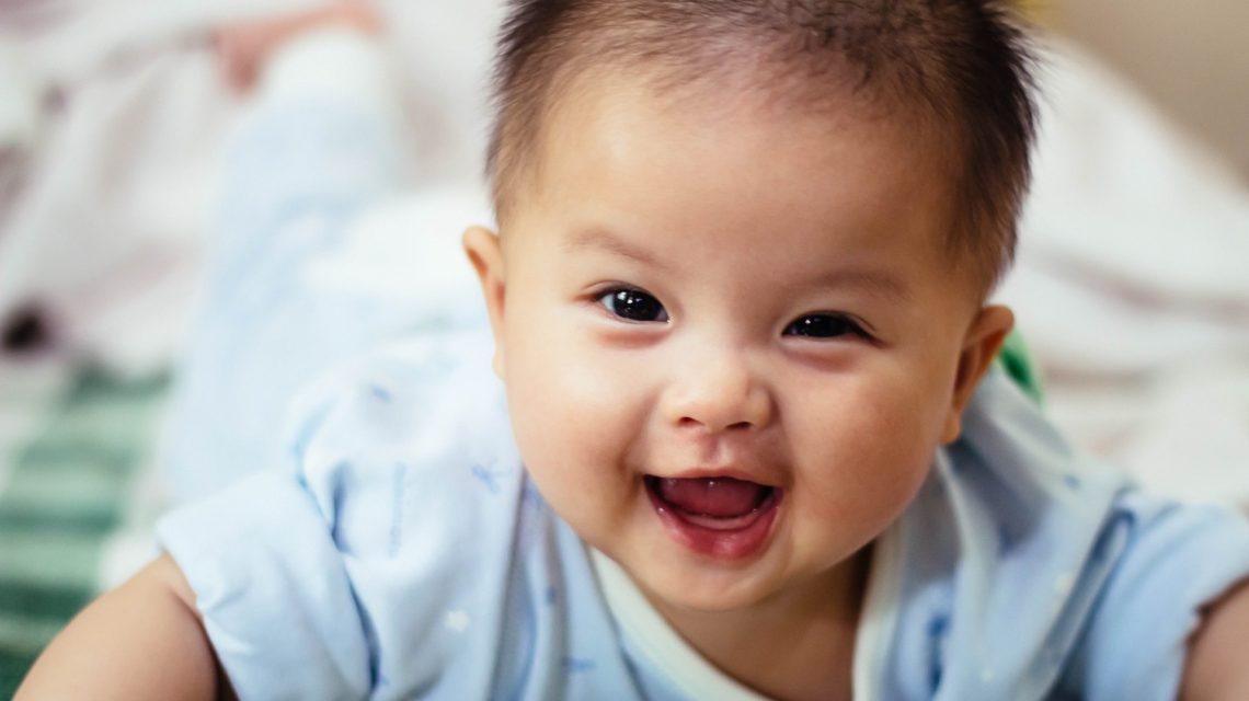 how to care for baby's gums - smiling baby