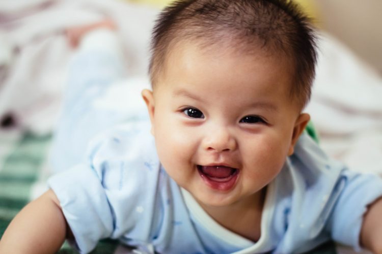 how to care for baby's gums - smiling baby