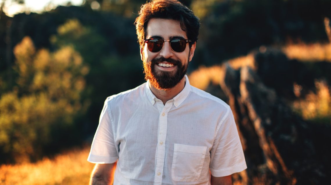 man smiling wearing sunglasses
